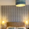 Thistle wallpaper Tartan Shade Cushions at Applecross Inn by Clement Design
